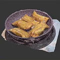 Golden Crispy Fried Dumplings in Black Stone Pan on Stove Top