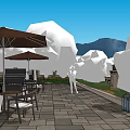 Courtyard Garden Leisure Area With Outdoor Umbrellas Tables Chairs Lush Green Plants And Distant Mountains