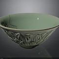 Carved Ceramic Bowl With Intricate Lotus Patterns Light Green Glaze and Visible Edge Crack