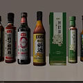 Various Chinese Condiment Bottles Including Soy Sauce Cooking Wine And Oils For Kitchen Use