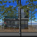 Container Cafe With Outdoor Wooden Deck Seating Umbrella And Green Plants On Lawn