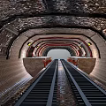 Train Tunnel Interior With Railway Track Metal Structure Brick Walls And Lights