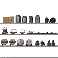 Elegant Tea Set Display with Teapots Canisters and Decorative Tea Cakes on Shelves