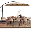 Stylish Outdoor Table with Arched Umbrella and Wicker Chairs on Wooden Deck with Vase Bowls