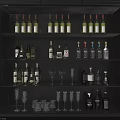 Modern Illuminated Wine Cabinet Shelves With Various Wine Liquor Bottles And Glassware