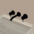 Modern Wall Mounted Black Faucet With Dual Handles On Light Colored Countertop