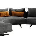 Modern Curved Sectional Sofa With Gray Upholstery And Orange Cushions