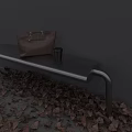 Sturdy Metal Outdoor Bench With Brown Bag Black Cup And Fallen Leaves By Gray Wall
