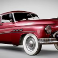 Vintage Red Classic Car With White Wall Tires Chrome Grille And Sleek Body Design