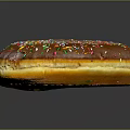 Delicious Chocolate Frosted Donut Topped With Colorful Sprinkles On Black Background