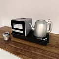 Stylish Kitchen Countertop With Silver Electric Kettle Coffee Maker And Glass Jar