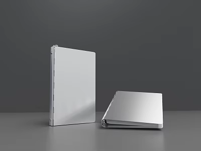 Two Silver Notebooks One Upright And One Open On Grey Tabletop 3d model