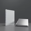 Two Silver Notebooks One Upright And One Open On Grey Tabletop 3d model
