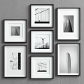 White Framed Black And White Architectural Photos On Gray Wall Gallery