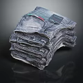 Classic Blue Denim Jeans Stacked With Brand Tags On Black Background