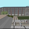 School Building With Red Brick Exterior Front Plaza Lawn And Students Walking