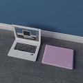 White Dell Laptop Open With Screen Display And Pink Laptop Case On Wooden Floor