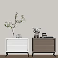 Modern White and Brown Bedside Tables with Woven Drawers Vase Plant Figurine and Books