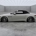 White Convertible Sports Car With Sleek Design Black Soft Top And Alloy Wheels