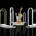 Elegant Cello Display With Arched Metallic Structures And Circular Platforms