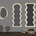 Decorative Wavy And Irregular Wall Mirrors With Small Round Mirrors On Wooden Table Top
