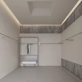 Modern Minimalist Clothing Store Entrance Featuring Clothing Racks Mirror And Shutter