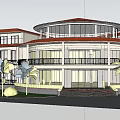 Modern Circular Hotel Building With Orange Roof White Columns Black Railings Palm Trees And Greenery