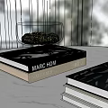 Stacked Books With Glass Bowl Containing Green Moss On Table Top