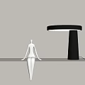 Modern Table Lamp With Black Shade Dark Base Warm Lighting And White Figurine On Shelf