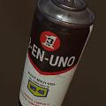 Industrial Equipment Two Lubricant Spray Cans with Red Caps for Machinery Maintenance