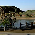 Scenic Garden Landscape With Two Large Water Wheels River Mountains Houses And Trees Along Shore