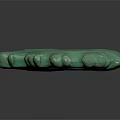 Green Dragon Shaped Jade Like Sculpture With Intricate Patterns And Curled Design