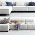 Modern Light Colored Sectional Sofa With Accent Pillows Throw Blanket And Decorative Items 3d model