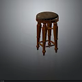 Classic Wooden Stool With Upholstered Seat Carved Legs And Decorative Rivet Details