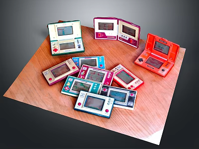 Multiple Portable Game Consoles in Various Colors on Wooden Tabletop Entertainment Electronics 3d model