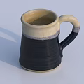 Black and Cream Ceramic Mug With Textured Surface And Curved Handle On White Background