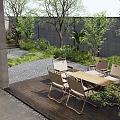 Serene Courtyard Garden With Wooden Deck Coffee Table Floor Cushions And Lush Green Plants