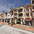 Row of Terraced Townhouses with Colorful Facades Balconies and Urban Street View