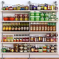 Variety Of Assorted Food Products On Shelves With Bottles Jars And Cans