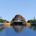 Unique Modern Cultural Center Building With Curved Design And Water Reflection Surrounded By Trees