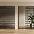 Modern Interior Featuring Black Frame Louvered Sliding Doors And Green Plant On Wooden Floor