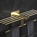 Elegant Golden Bathroom Rack Mounted on Black Marble Wall with Gray Towels