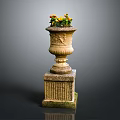 Elegant Decorative Stone Vase With Carved Base Holding Yellow Orange Flowers