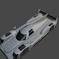Silver Prototype Racing Car With Streamlined Body Rear Wing And Sporty Design