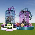 Blue And Pink Decorative Birdcages With Flowers On Round Bases In Green Grass