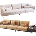 Modern Three Seater Sofa with Light Beige and Brown Cushions Side Table Lamp and Books