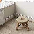 Wooden Stool With Round Worn Seat Crossed Legs Near White Radiator On Wooden Floor