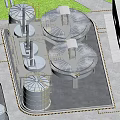 Aerial View of Industrial Plant Surrounded by Green Hills With Multiple Buildings and Industrial Equipment