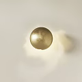 Elegant Golden Spherical Wall Lamp Illuminating White Wall With Soft Glow 3d model