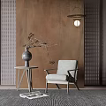 Light Gray Accent Chair by Side Table with Dried Branch Vase and Brown Textured Wall